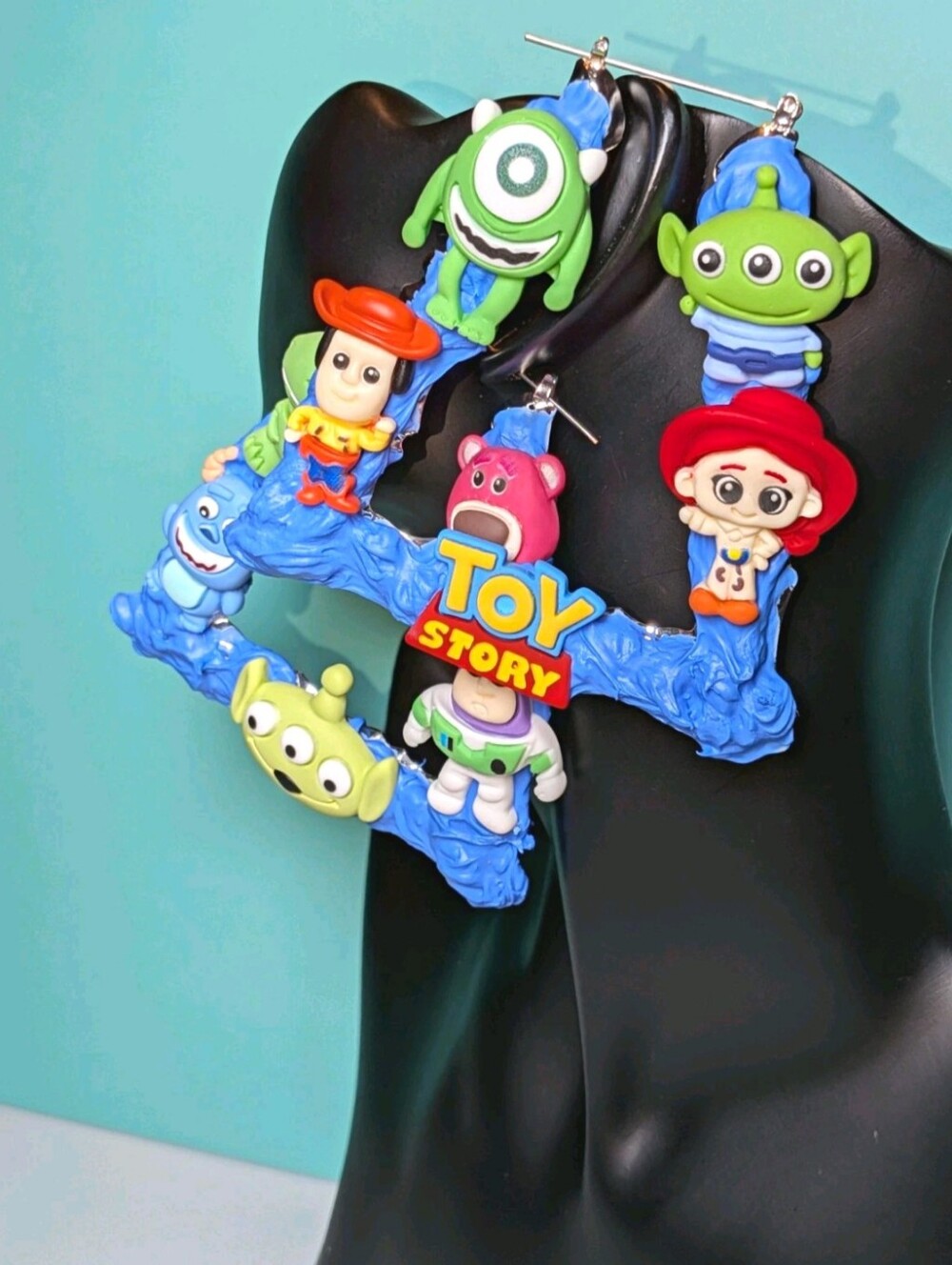 Hand Crafted Women Blue Toy Story Character Earrings with Red and Green Accents